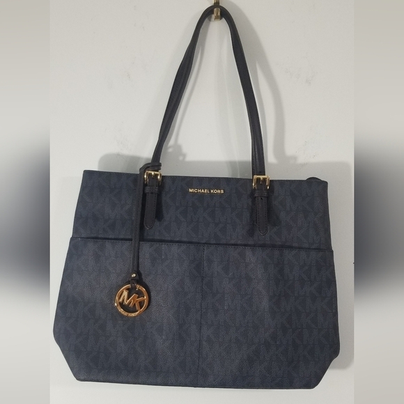 Michael Kors Leather Monogrammed Purse. 4 Exterior Slip Pockets. Clean Interior. - Picture 1 of 14